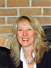 Tammie Ross, a woman with blond hair smiling towards the camera.